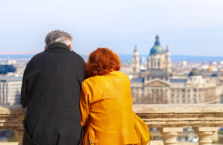 Elderly couple hugging and enjoying the beautiful Budapest viewの写真素材