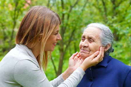 Picture of proud old woman with her loving granddaughterの写真素材