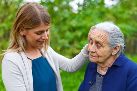 Picture of an old lady taking a walk with her granddaughterの写真素材