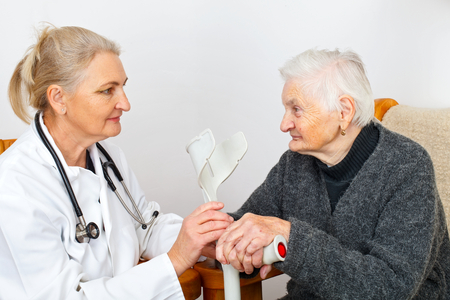 Picture of a disabled senior woman with her caregiverの写真素材