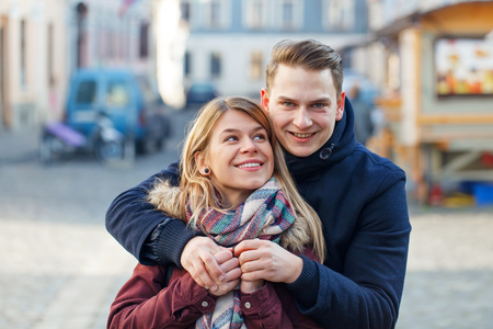Photo of a beautiful young couple posing outdoorの写真素材