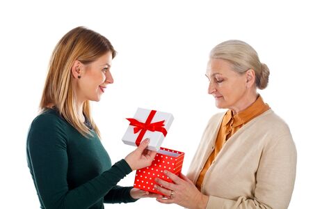 Picture of a beautiful young girl spending Christmas time with her motherの写真素材