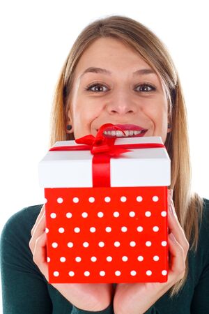 Picture of a happy woman holding a Christmas giftの写真素材