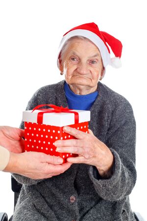 Picture of an elderly woman receiving a Christmas giftの写真素材