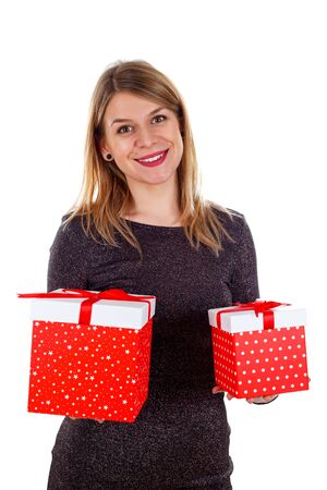 Picture of a smiling woman holding Christmas gifts on an isolated backgroundの写真素材