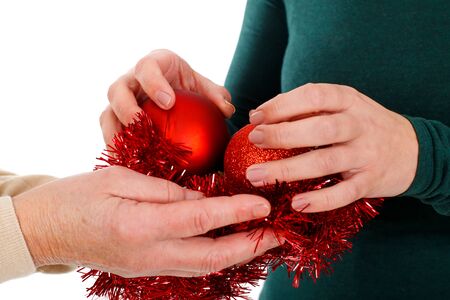 Close up picture of woman holding Christmas decorationの写真素材