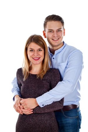 Picture of a happy young couple posing on an isolated backgroundの写真素材