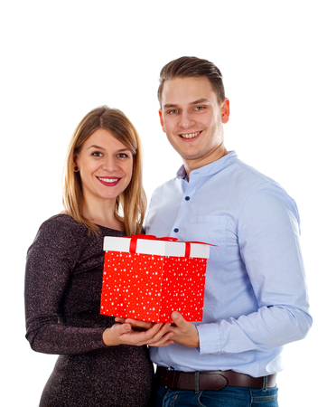 Picture of an attentive man giving a surprise-gift to his girlfriendの写真素材