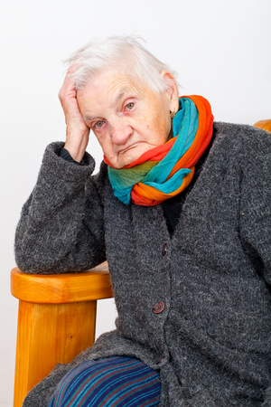 Picture of an ill elderly woman being lonelyの写真素材