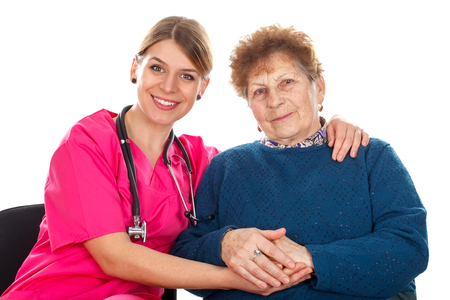 Picture of an elderly woman with her assistantの写真素材
