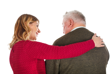 Picture of a young woman helping an elderly man - isolated backgroundの写真素材