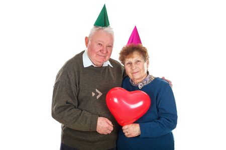 Portrait of a senior couple celebrating birthday - isolated backgroundの写真素材