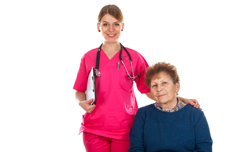 Picture of an elderly woman with her smiling physician - isolated backgroundの写真素材