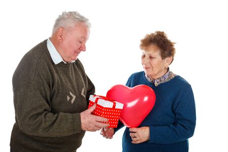 Picture of an old couple celebrating anniversary - isolated backgroundの写真素材