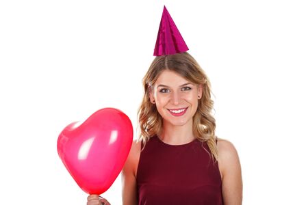 Picture of a sweet young girl celebrating her boyfriend's birthday - isolated backgroundの写真素材