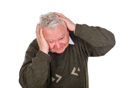 Picture of an elderly man being anxious because of his medical diagnosisの写真素材
