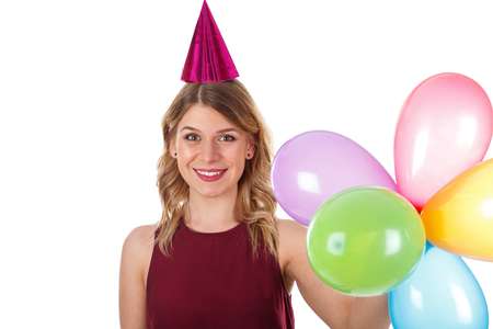 Picture of a sweet young girl celebrating birthday - isolated backgroundの写真素材
