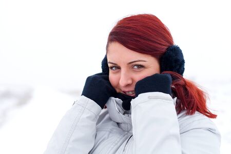 Portrait of a beautiful lady feeling cold on wintertimeの写真素材