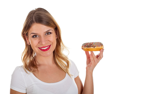 Picture of a sexy young woman holding a chocolate doughnutの写真素材