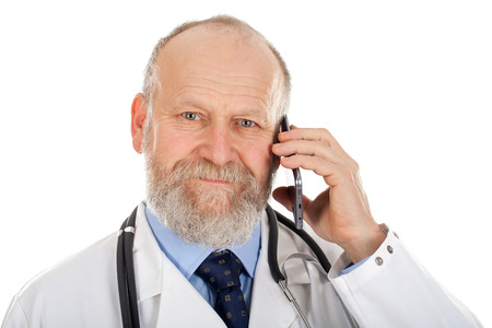 Picture of a confident doctor making a phone callの写真素材