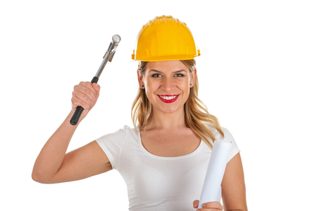 Picture of an attractive female engineer holding a hammerの写真素材