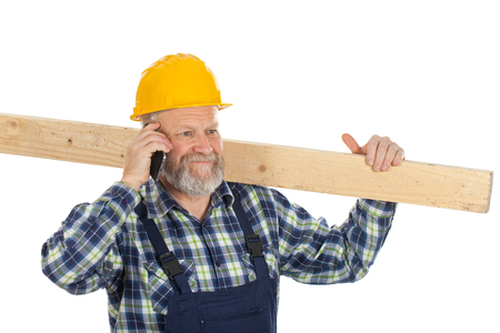 Picture of a happy engineer talking on the phoneの写真素材