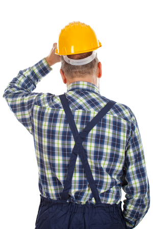 Picture of an engineer standing backward on an isolated backgroundの写真素材