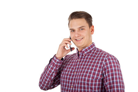 Picture of a handsome young man making a phone callの写真素材