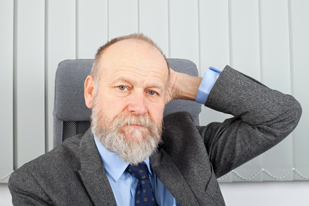 Picture of a thoughtful businessman at the officeの写真素材