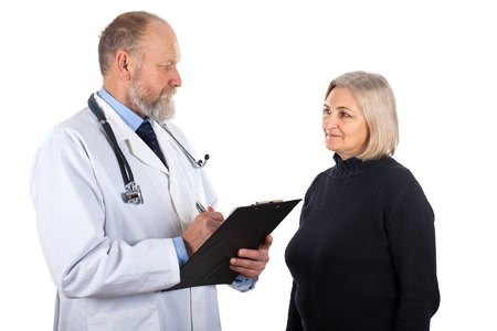 Picture of a middle aged woman and her doctor - isolated backgroundの写真素材