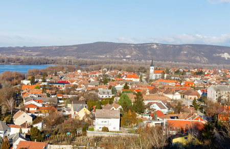 Panoramic view of rooftops and treetops in a city neighborhood and the Danube riverの写真素材