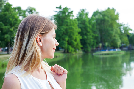 Picture of a happy woman posing by a lake in Gyula, Hungaryの写真素材
