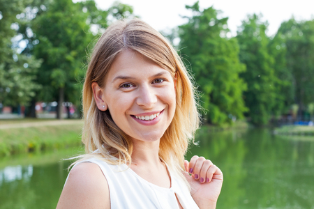 Picture of a happy woman posing by a lake in Gyula, Hungaryの写真素材