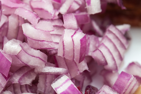 Close up picture of chopped tasty red onionの写真素材