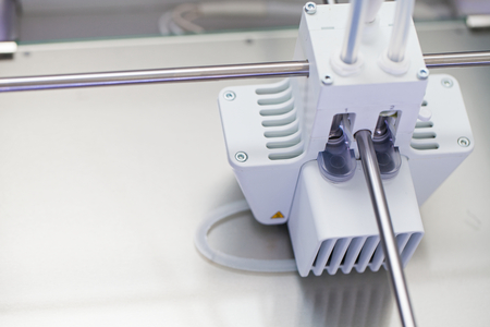 White electronic 3d printer. Plastic printing. Modern technology
