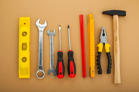 Construction equipment, tools on gradual orange backgroundの写真素材