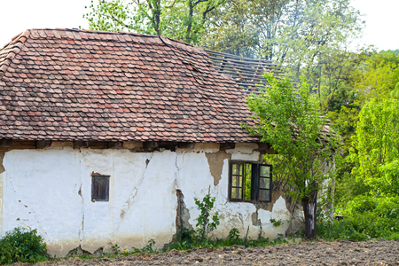 Old abandoned small cottage in the middle of Transylvania, Romaniaの写真素材