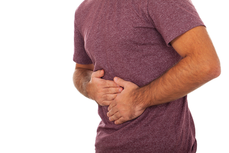 Picture of a young adult having an abdominal painの写真素材
