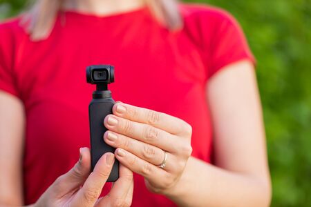 Close up picture of osmo camera in female hands
