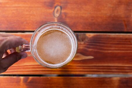 Close up picture of fresh cold draught beer on a restaurant table  - top viewの写真素材