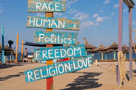 Quotes on wooden colorful signs at Vama Veche beach, Romaniaの写真素材