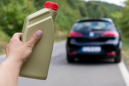 Picture of the man holding  an oil bottleの写真素材