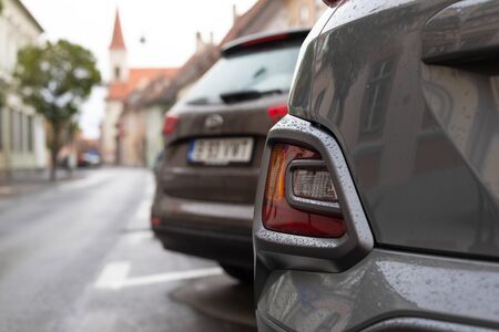 Scenic picture of a street in Sibiu medieval center, cars parked along the road