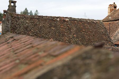Top view of an old  red roof tileの写真素材