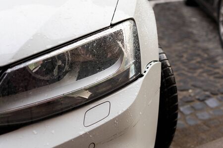 Scenic picture of a street in Sibiu medieval center, cars parked along the roadの写真素材