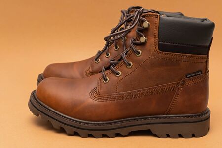 Photo of a brand new brown stylish winter boots
