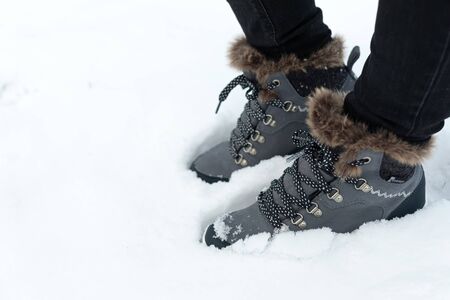 Picture of a comfortable women's warm boots in the snowの写真素材