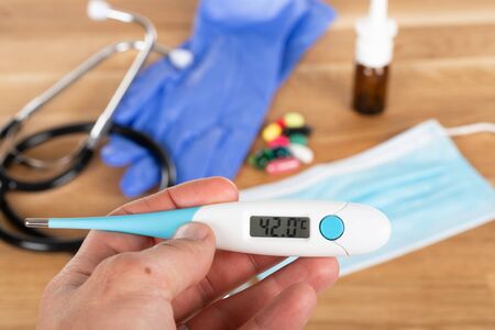 Close up picture of medical drugs and tools on wooden background