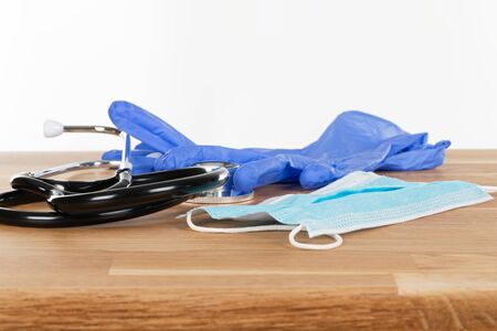 Close up picture of medical drugs and tools on wooden background