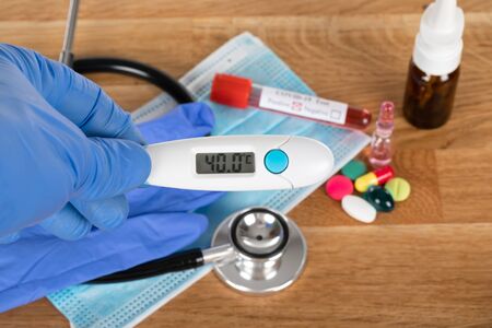 Close up picture of medical drugs and tools on wooden background